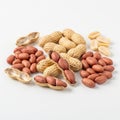 Assorted nuts including peanuts and marcona almonds displayed on a white background Royalty Free Stock Photo