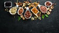 Assorted nuts on the old black background. Royalty Free Stock Photo