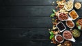 Assorted nuts on the old black background. Royalty Free Stock Photo