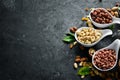 Assorted nuts on the old black background. Royalty Free Stock Photo