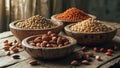 Assorted Nuts and Pulses Displayed in Wooden Bowls on Table Royalty Free Stock Photo