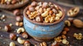 Assorted nuts in rustic bowl on wooden background Royalty Free Stock Photo