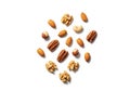 Assorted nuts are scattered on a white background. The variety Royalty Free Stock Photo