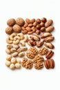 Assorted nuts on a white background. Walnuts, almonds, hazelnuts, Brazil nuts, cashews, pistachios, macadamia nuts, pecans, Royalty Free Stock Photo