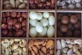 Assorted nuts in a wooden box. Set of almonds, peanuts, cashews, pistachios, macadamia, hazelnuts