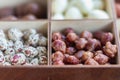 Assorted nuts in a wooden box. Set of almonds, peanuts, cashews, pistachios, macadamia, hazelnuts