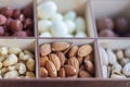 Assorted nuts in a wooden box. Set of almonds, peanuts, cashews, pistachios, macadamia, hazelnuts