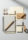 Assorted office stationery on a light background. Includes a spiral-bound notebook Royalty Free Stock Photo