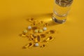 Assorted Oil filled yellow softgels capsules and pills Royalty Free Stock Photo