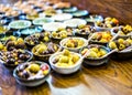 Assorted olives presented in a handmade pottery ramekins