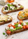 Assorted open faced sandwiches, Open avocado sandwiches made of slices of sourdough bread with various toppings