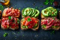 Assorted Open Sandwiches with Avocado, Smoked Salmon, Ham, and Fresh Vegetables on Dark Background, Healthy Meal Concept Royalty Free Stock Photo