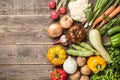 Assorted organic fresh vegetables on wooden table