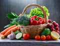 Assorted organic vegetables and fruits in wicker baske