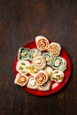 Assorted oriental sweets Turkish delight with nuts on a red plate Royalty Free Stock Photo