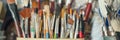 Assorted paintbrushes in a holder displaying various shapes and sizes Royalty Free Stock Photo