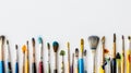 Assorted paintbrushes with paint splatters on a white background, ready for art creation Royalty Free Stock Photo