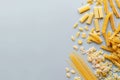 Assorted pasta types on gray background overhead shot with copy space for photography Royalty Free Stock Photo
