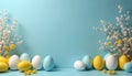 Assorted pastel Easter eggs and delicate white flowers arranged on a clean blue backdrop. Copy space is available in the center Royalty Free Stock Photo