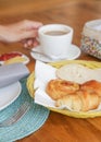 Assorted pastries, coffee and marmalade on the table