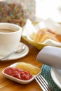 Assorted pastries, coffee and marmalade on the table