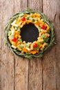 Assorted pesto cheese, cheddar, Mimolette with tomatoes and rose Royalty Free Stock Photo