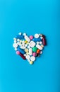 Assorted pharmaceutical medicine pills. Heart shape Royalty Free Stock Photo