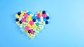 Assorted pharmaceutical medicine pills, tablets and capsules for the treatment of heart disease. Heart shape of pills. Copy space Royalty Free Stock Photo