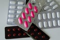 Assorted pharmaceutical medicine pills on white backround