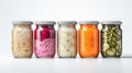 Assorted pickled or fermented vegetables in jars on white, sealed and stored