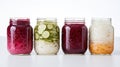 Assorted pickled or fermented vegetables in jars on white, sealed and stored