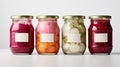 Assorted pickled or fermented vegetables in jars on white, sealed and stored