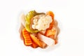 Assorted pickles vegetables in white bowl, Top view. Isolated