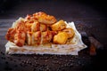 Assorted pieces of fried chicken. Grill dishes for the restaurant menu. Wooden background. Royalty Free Stock Photo