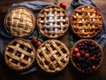 Assorted pies with lattice pastry, traditional thanksgiving dessert, autumn baking concept, top view.