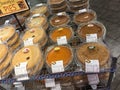 Pies displayed in suburban supermarket bakery section. Selection of various pies to entice customers