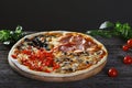 Assorted Pizza with bacon, mushrooms, peppers and olives on the Royalty Free Stock Photo