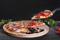 Assorted Pizza with bacon, mushrooms, peppers and olives on the Royalty Free Stock Photo