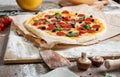 Assorted pizza with different fillings served on wooden table with ingredients Royalty Free Stock Photo