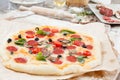 Assorted pizza with different fillings served on wooden table with ingredients Royalty Free Stock Photo