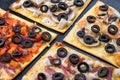 Assorted pizza slices. Margherita, pepperoni, four cheese pizza. Top view. Different types of pizza on the textured old Royalty Free Stock Photo