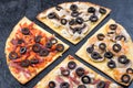 Assorted pizza slices. Margherita, pepperoni, four cheese pizza. Top view. Different types of pizza on the textured old Royalty Free Stock Photo