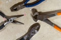 Assorted Pliers on the ground Royalty Free Stock Photo