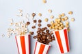 Assorted popcorn set in paper striped white red cup Royalty Free Stock Photo