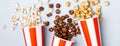 Assorted popcorn set in paper striped white red cup Royalty Free Stock Photo