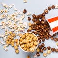 Assorted popcorn set in paper striped white red cup. Sweet and salty popcorn Royalty Free Stock Photo