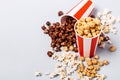 Assorted popcorn set in paper striped white red cup. Sweet and salty popcorn Royalty Free Stock Photo
