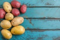 Assorted Potatoes on Rustic Blue Wooden Surface