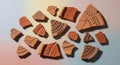 Assorted pottery shards displayed against a Royalty Free Stock Photo