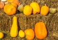 Assorted Pumpkins & Squash On Hay Bales